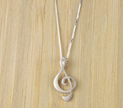 Treble clef pendant, silver