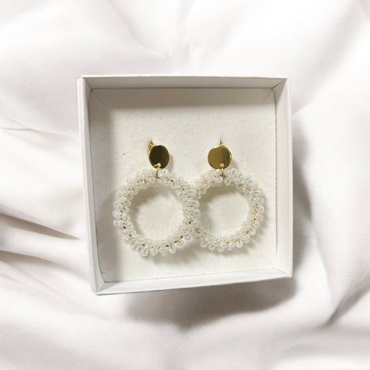 Loviisa earrings, with a jagged button